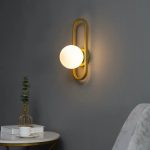 applique murale en verre blanc avec cadre doré